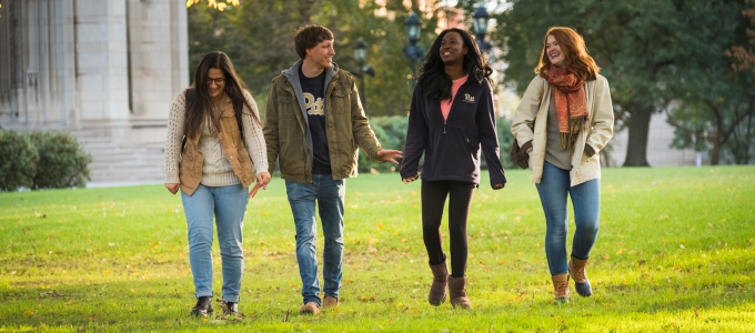 students walking on Pitt campus 